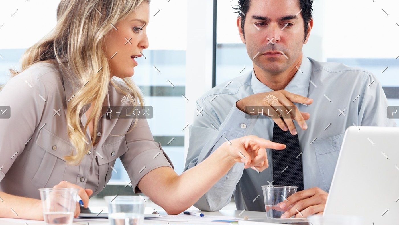 demo-attachment-1152-businessman-and-businesswoman-meeting-in-office-PZZXTMB